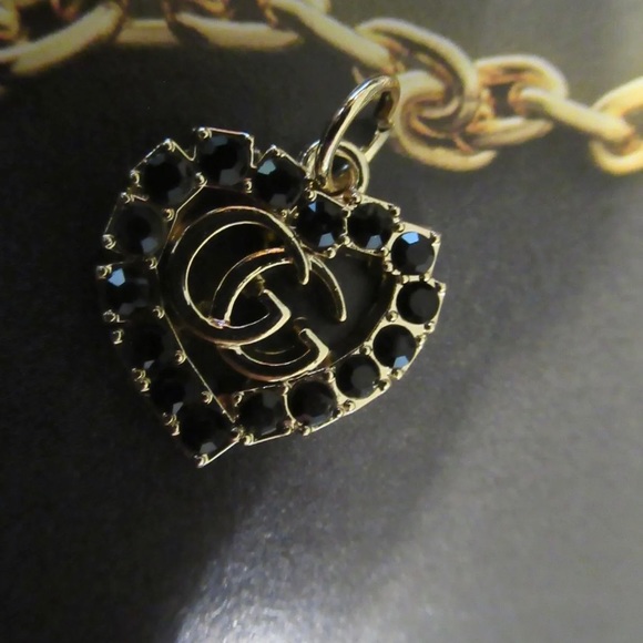 Gucci Jewelry - GUCCI ZIP PULL/CHARM 22X20MM gold tone, with chain